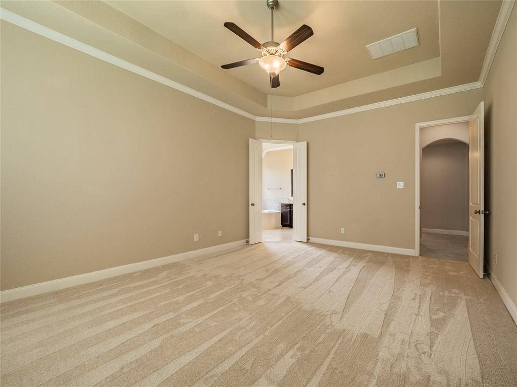 from the view of the primary you can see the entrance door, the spacious flooring and the door to you very own retreat