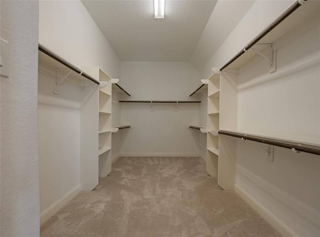 primary walk in closet which is oversized and roomy