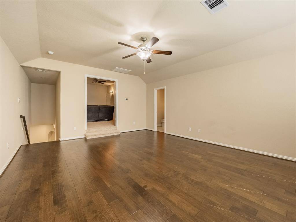from here you can see as you enter the game room from the stairs you have your media room on the left which is wired for surround sound , ceiling fan and to the right is the half bath