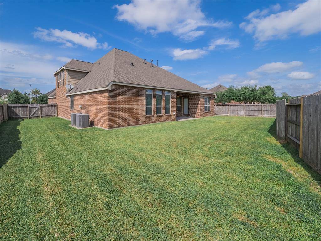 very large oversized back yard , large enough for a pool , the home has 2 units and has a covered back yard