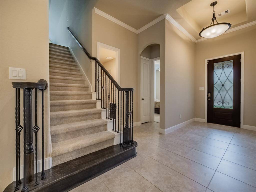 as you enter the front door you have your guest suite on the right with private bath and on the left you have 2 bedrooms with a Hollywood bath and the beautiful staircase leads you to the media room and game room that has a half bath
