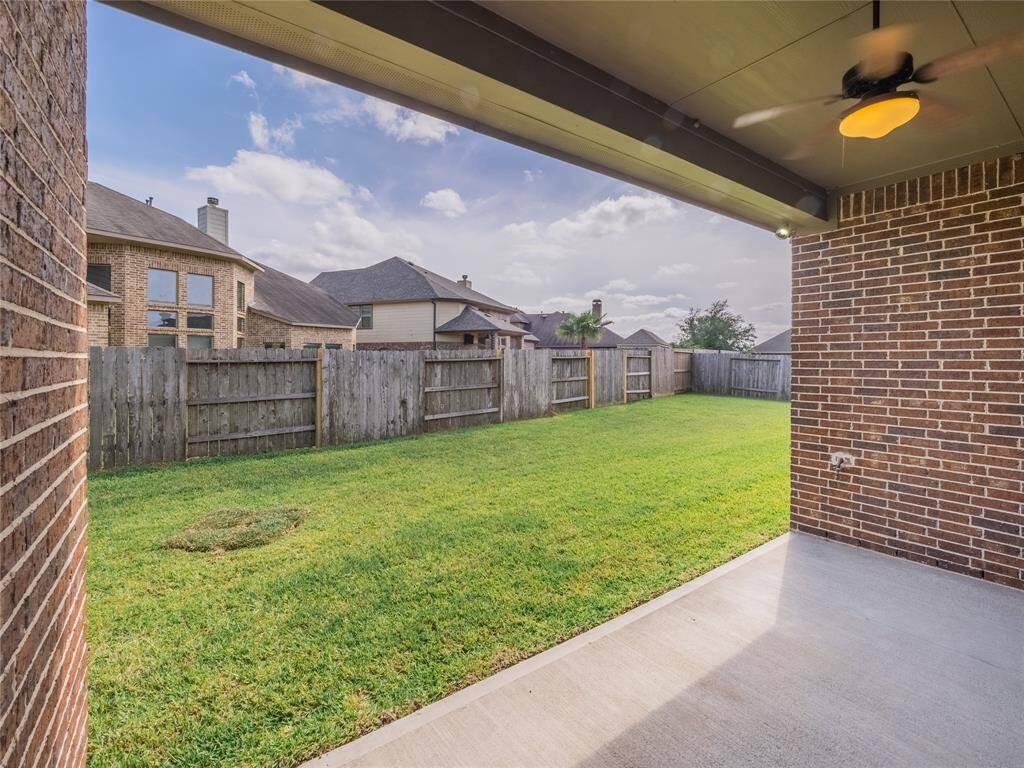 here you can see the covered  patio and the spacious back yard