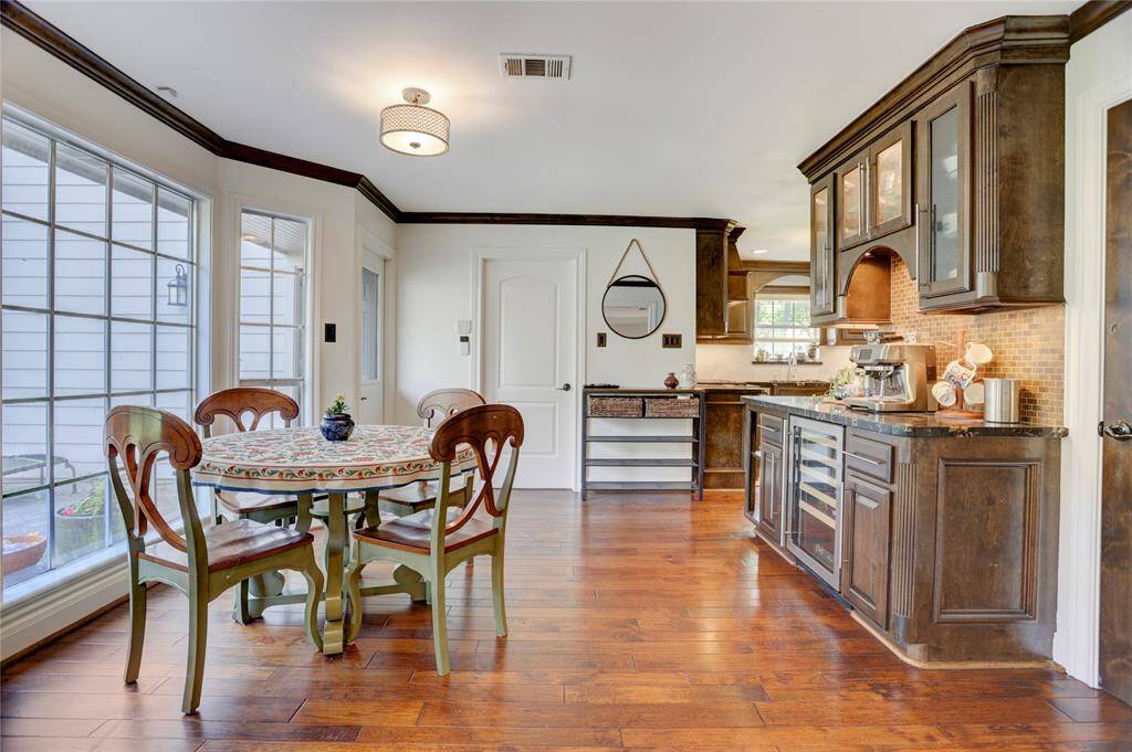 Between the kitchen and family room is a bay window breakfast area and dry bar.
