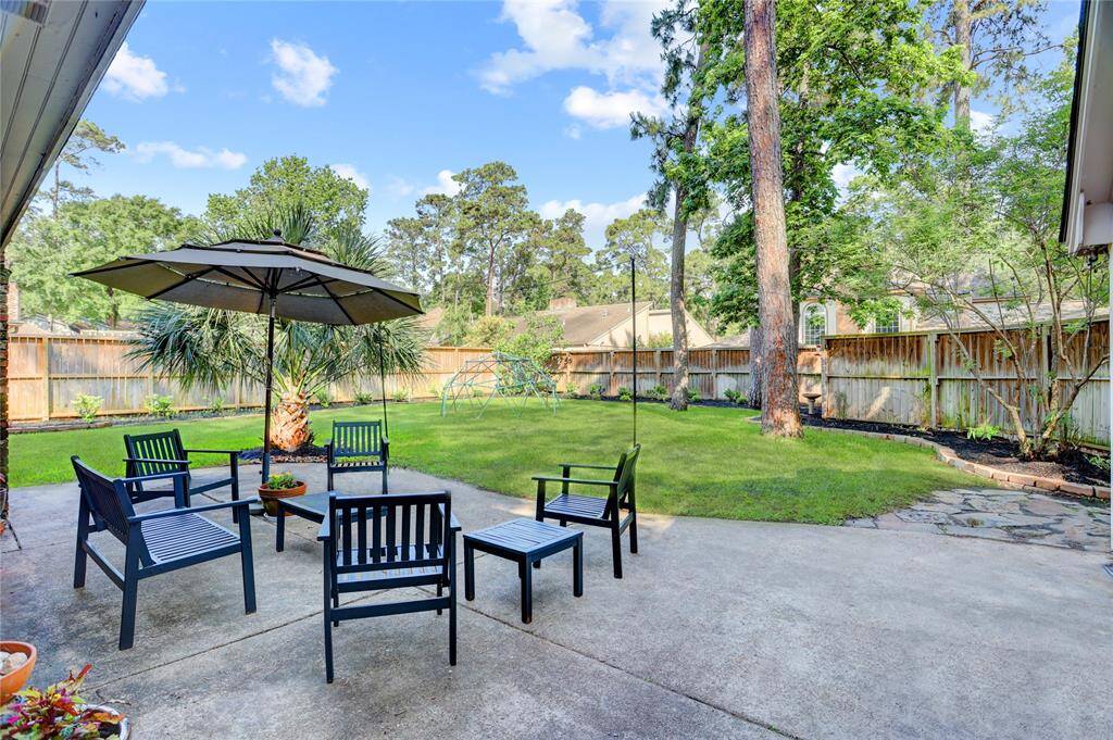 Step outside to enjoy or entertain on the concrete patio, plush backyard and manicured landscaping.