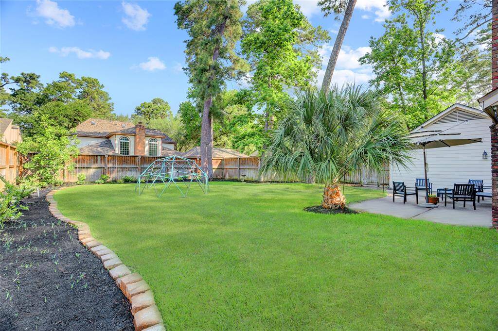 View of the backyard from the Southwest corner of the backyard.