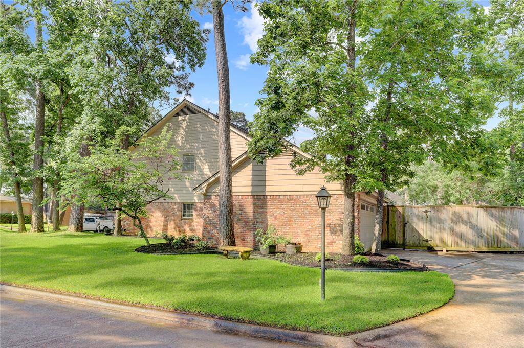 The private driveway is tucked around the side of the property and offers additional parking and easy garage access.