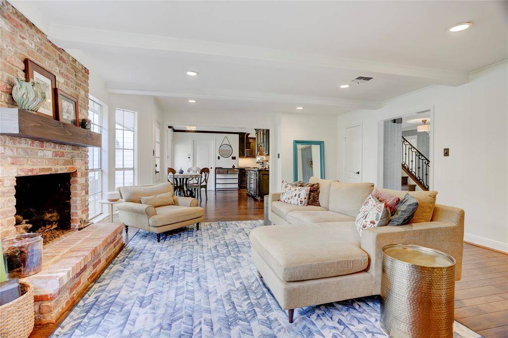 Situated at the back of the first floor is a spacious and bright family room with a gas-log fireplace.