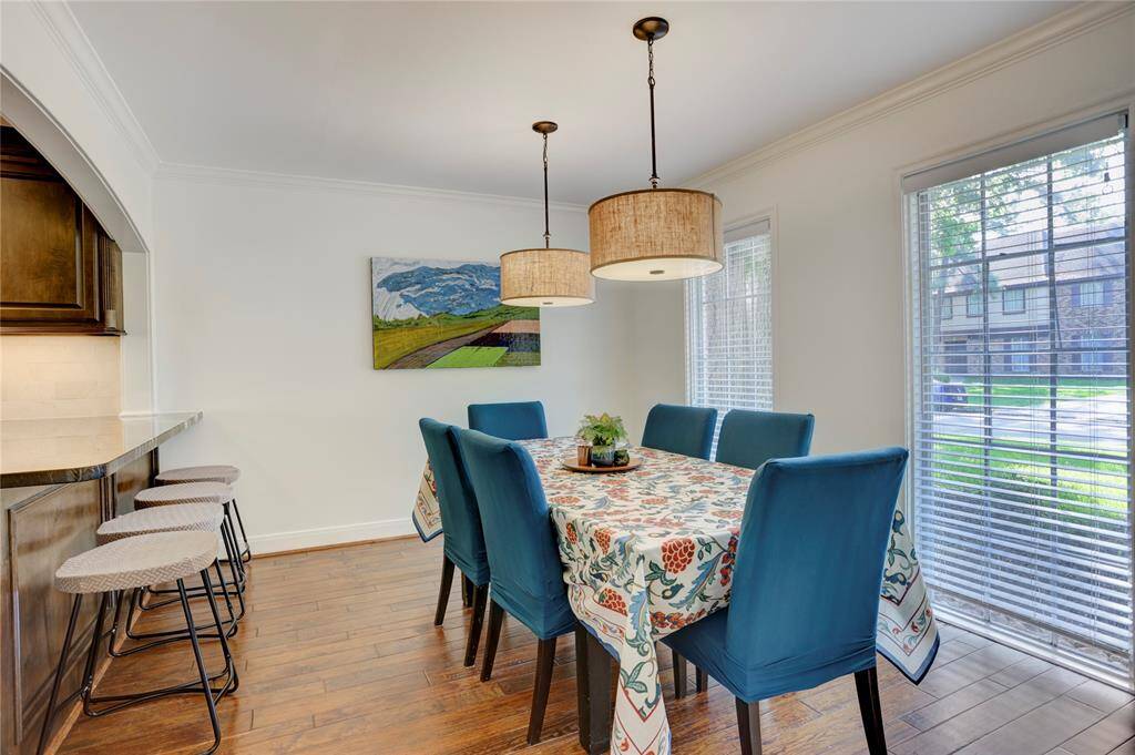 Open to the kitchen sits the dining room with two large windows.