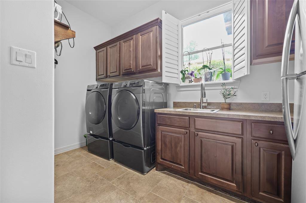 Large utility room with space for an additional refrigerator.
