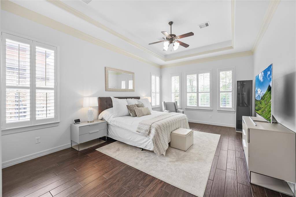 Your first floor primary bedroom with plantation shutters