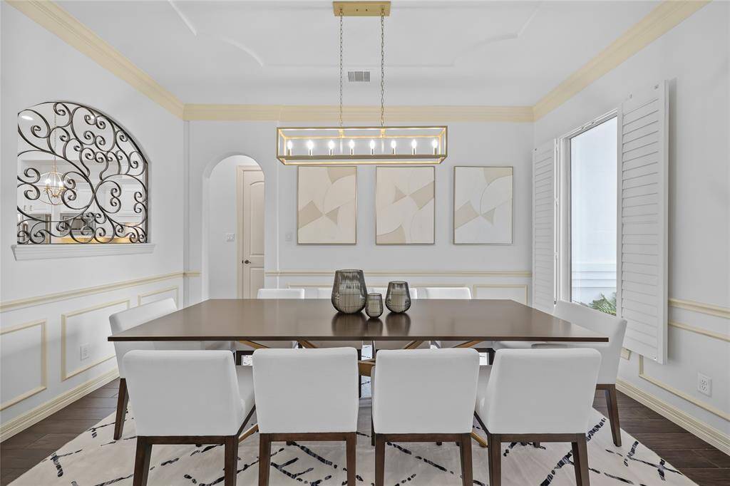 Your formal dining room with recently updated light fixture.