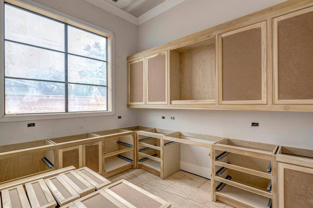1st floor office with lots of built-ins and large window. Stage of construction as of April 3, 2025.