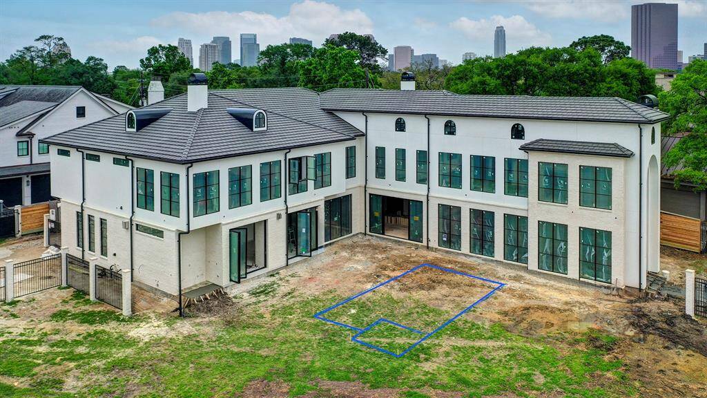 Spacious home built for entertaining on a large corner lot with gated front yard in Tanglewood. Stage of construction as of April 17, 2025.
