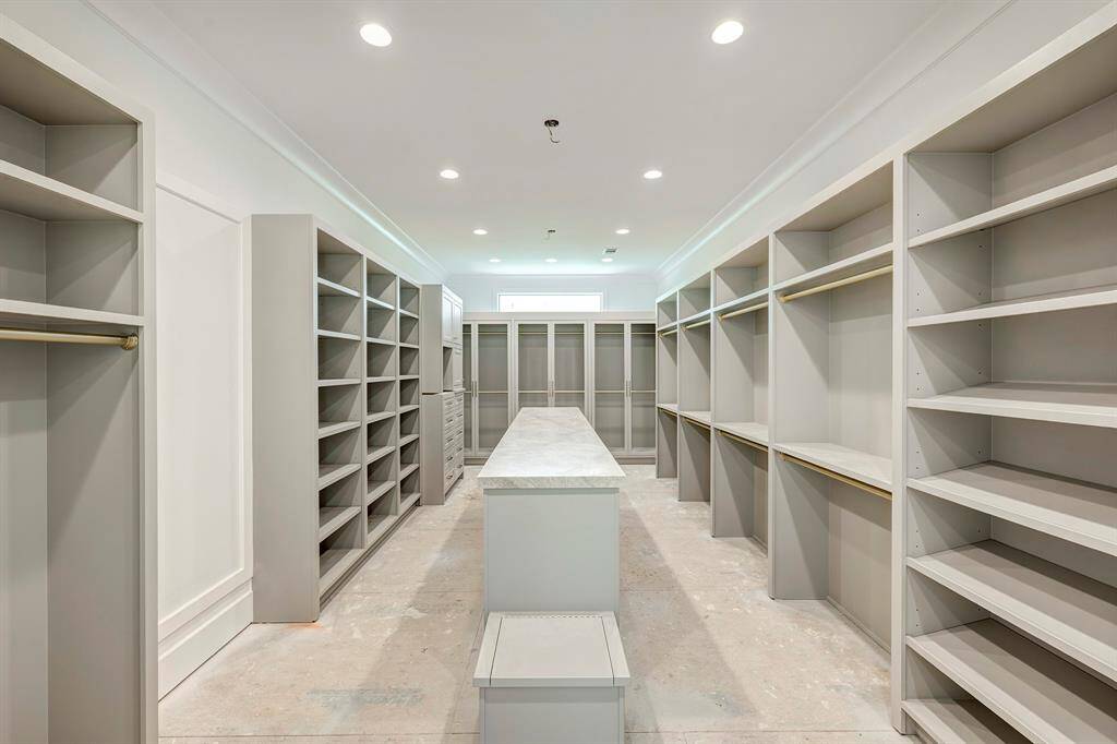 His closet with suit storage beyond the island as of April 17, 2025.