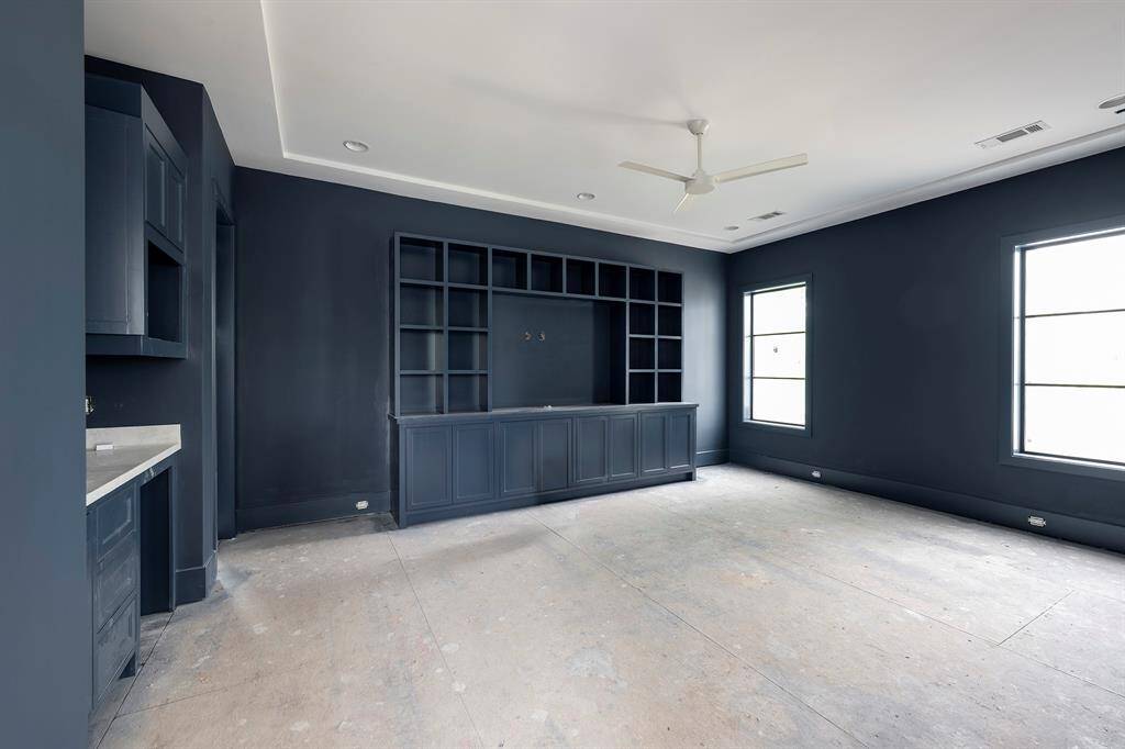 This flexible space on the 2nd floor can be used as a media room or a game room. Wet bar area to the left. Stage of construction as of April 3, 2025.