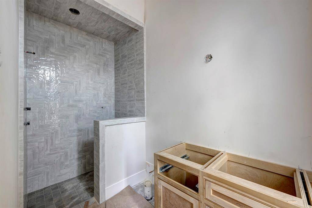 Secondary bathroom with beautiful tile work. Stage of construction as of April 3, 2025.