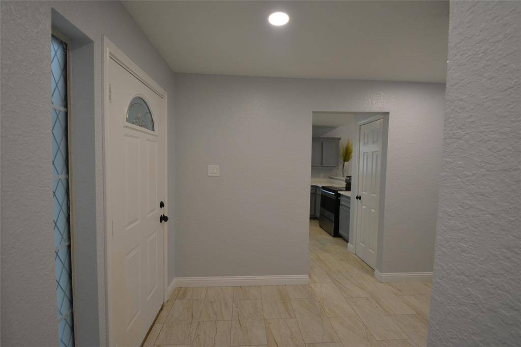 Front door, entryway and kitchen on the left.