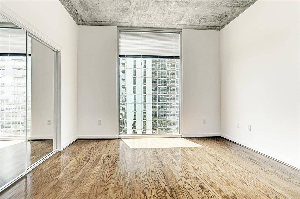 The 11x13 SF Second Bedroom has a great view of the pool 7 floors below.
