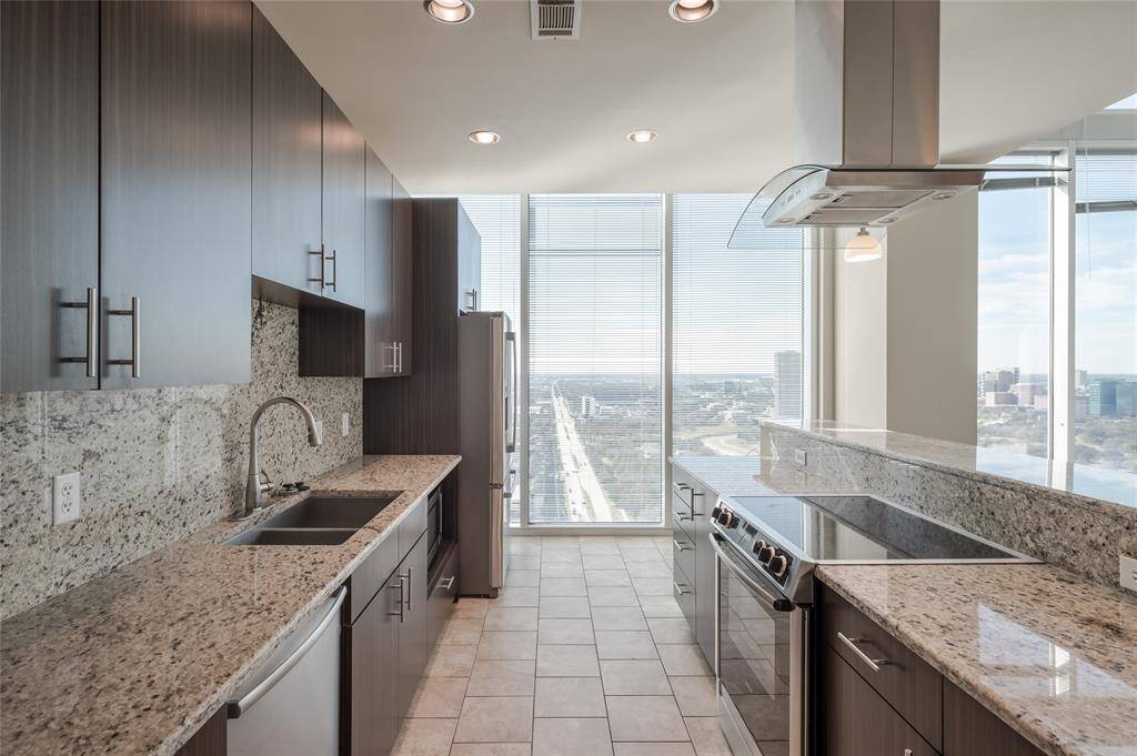 The penthouse kitchen is a showstopper in its own right — seamlessly blending functionality with raw, modern design.