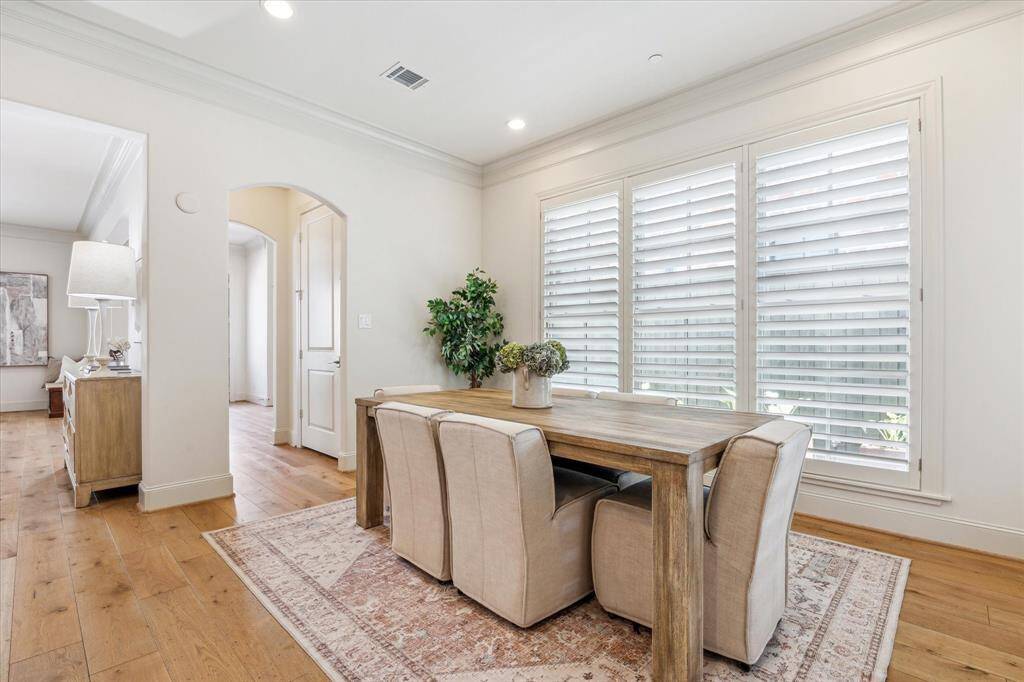 The Dining Room (15' x 8') is open to the Kitchen. There is a lovely garden outside the large windows in the Dining Room.