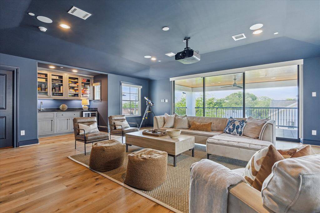 This great space includes a dry bar with beverage fridge and a large covered patio.