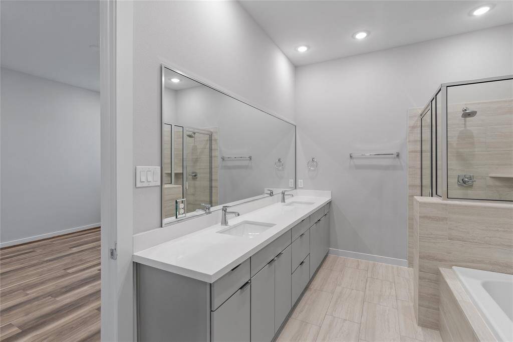 Primary bedroom bathroom with double sinks