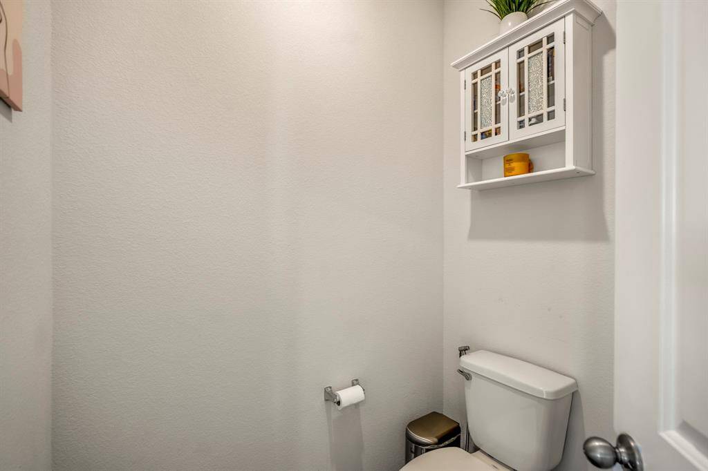 Cozy water closet within the ensuite for added convenience and privacy.