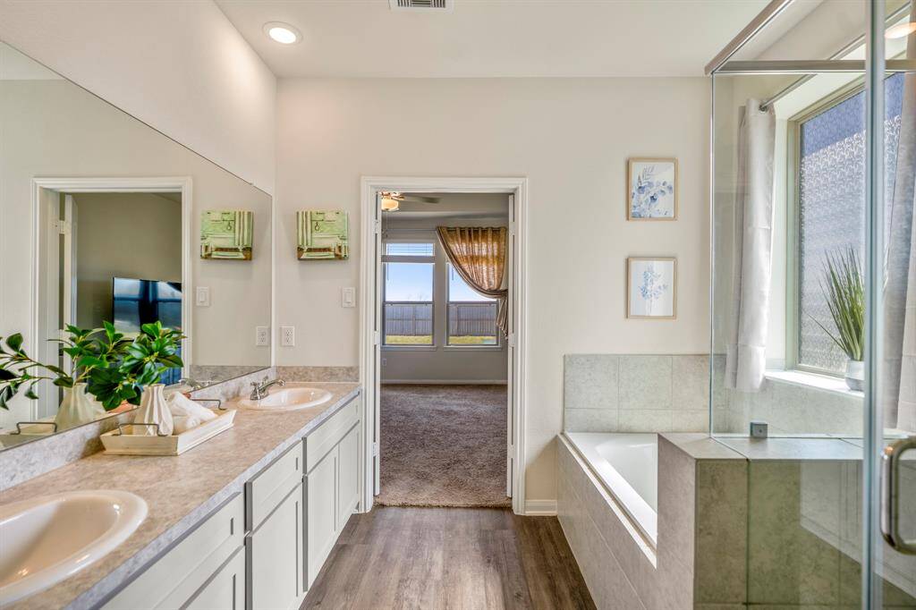 Luxurious ensuite with abundant natural light, perfect for relaxation.