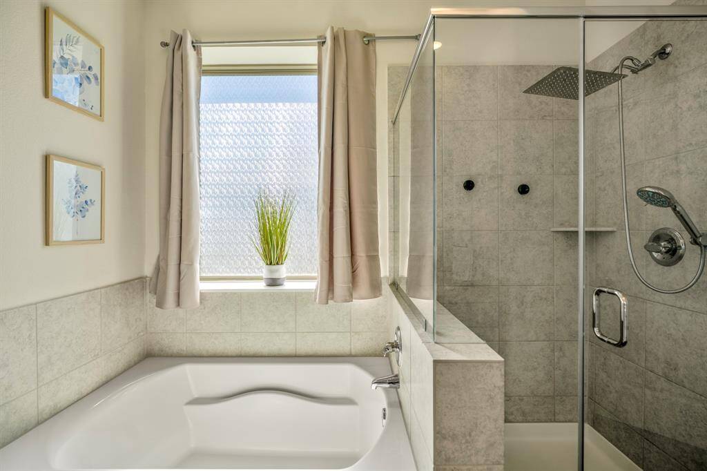 Luxurious bathroom with a separate tub and shower.