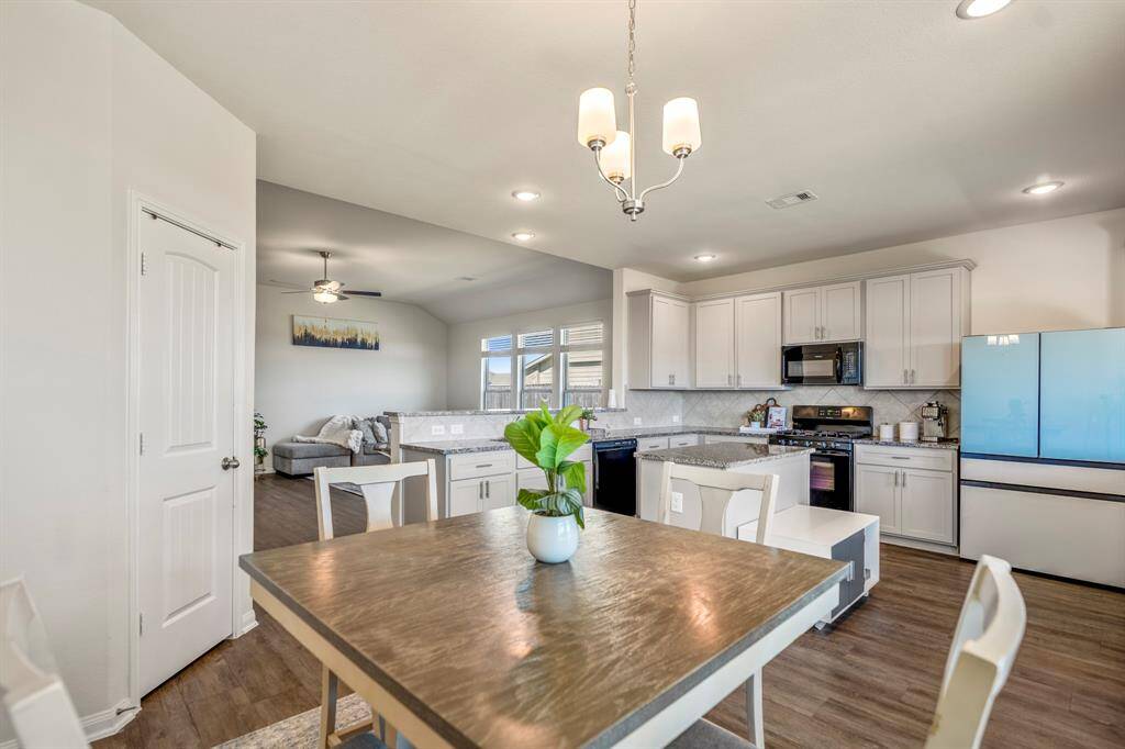 Enjoy seamless interaction in the open-concept kitchen and living room.