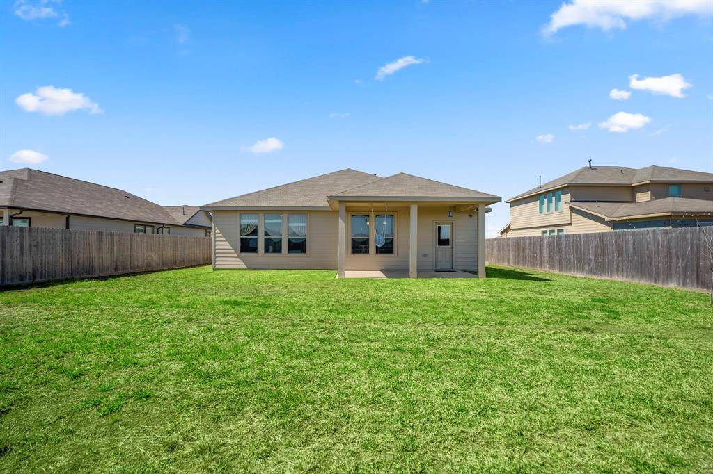 Expansive backyard ready for your dream garden or outdoor oasis. Perfect for family gatherings and relaxation.
