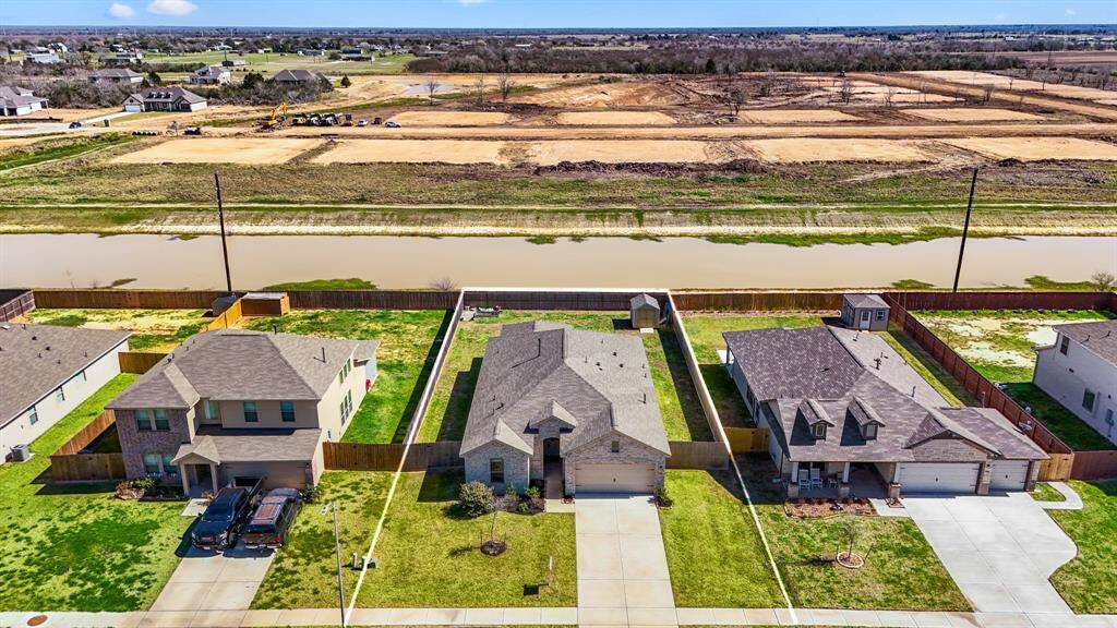 Explore this stunning home with a spacious backyard and serene water views. Perfectly situated for privacy, this home offers a peaceful retreat in a desirable neighborhood.