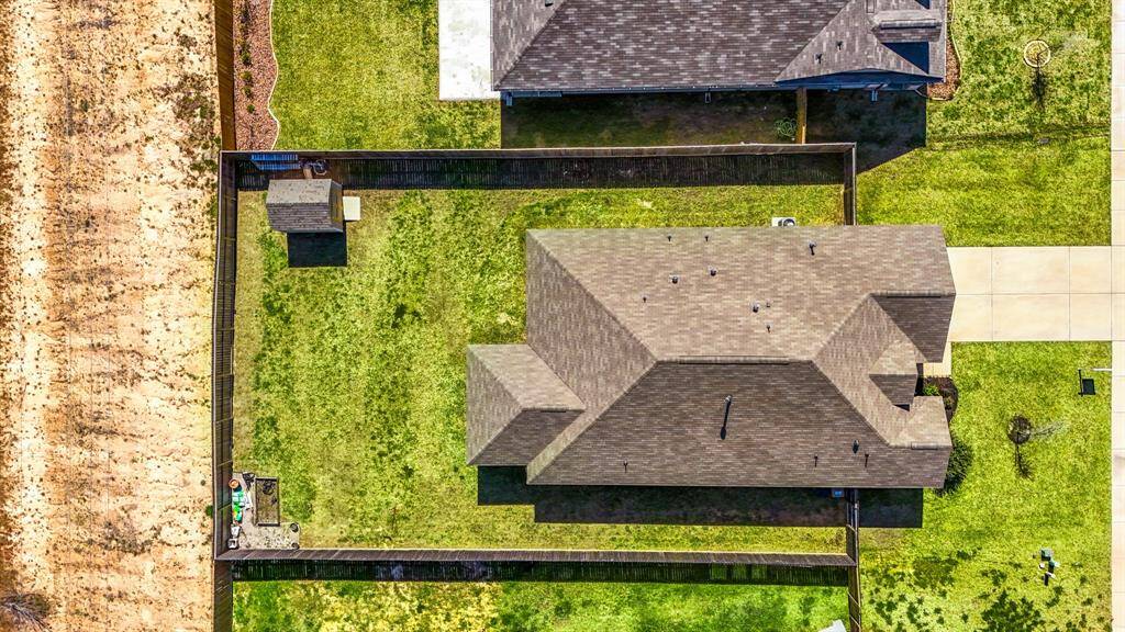 Expansive yard offering endless possibilities for outdoor living and recreation.