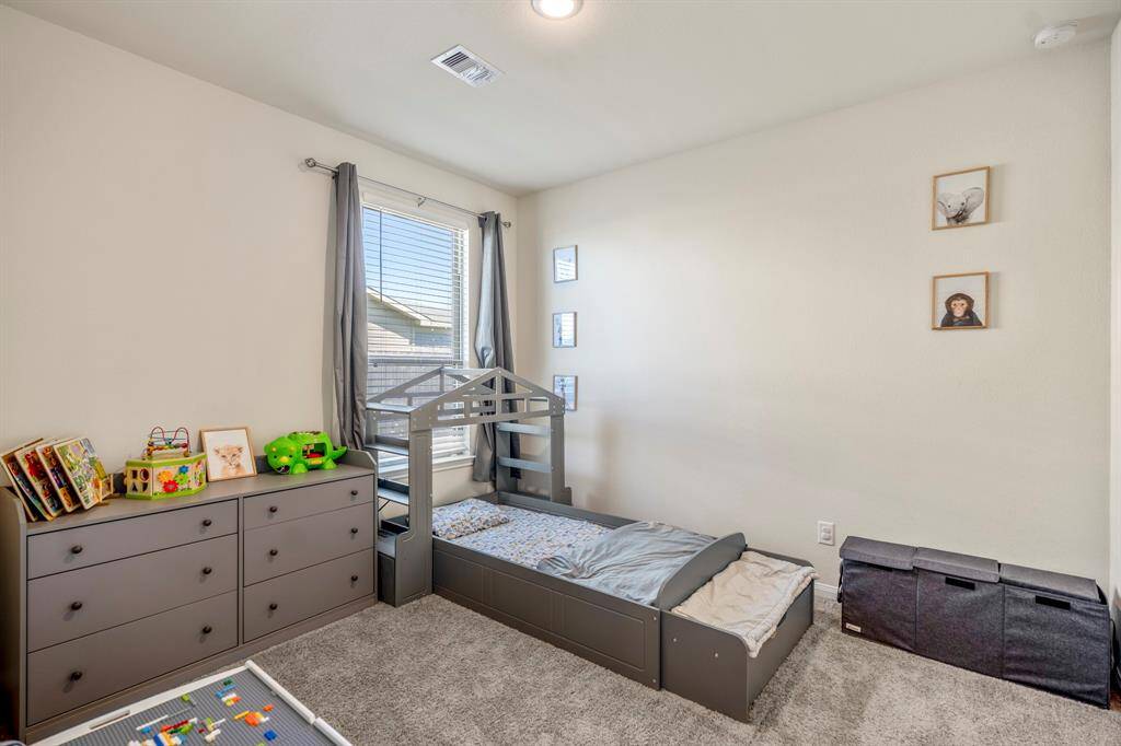 Bright and spacious bedroom with abundant natural light.