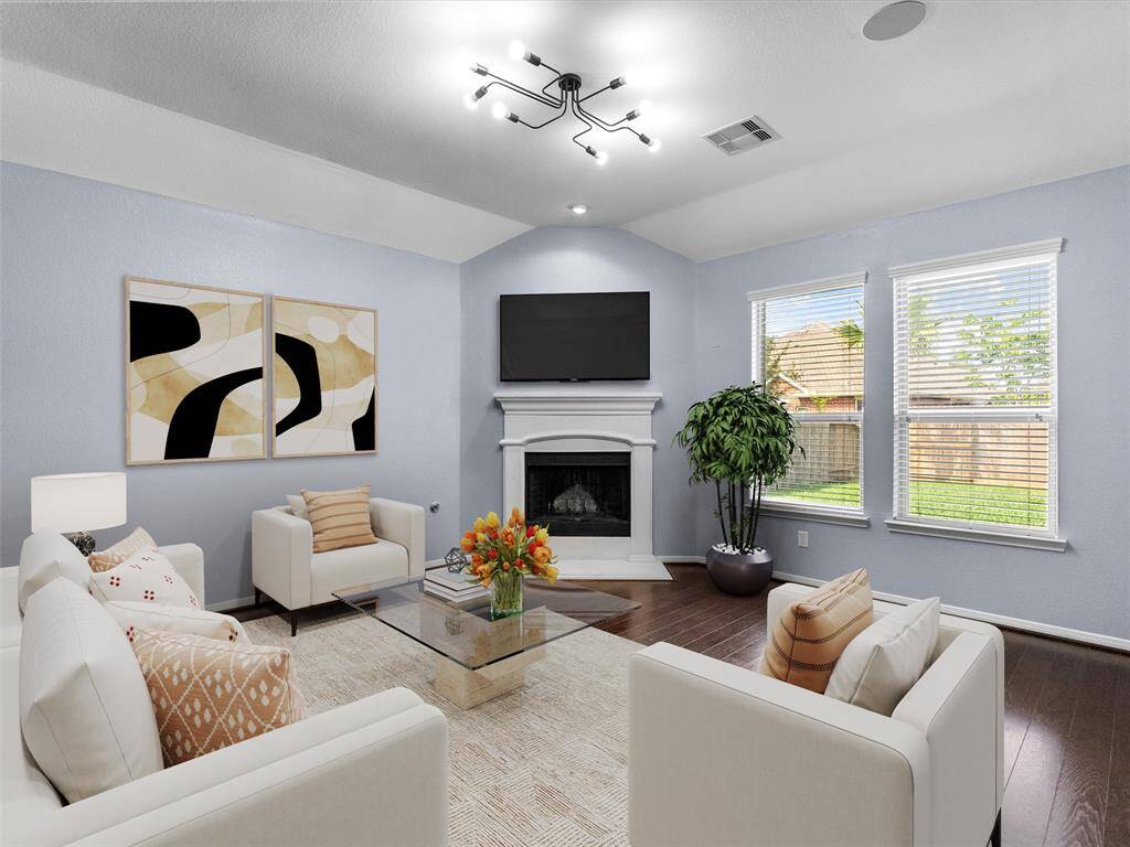 The living room features a cozy fireplace