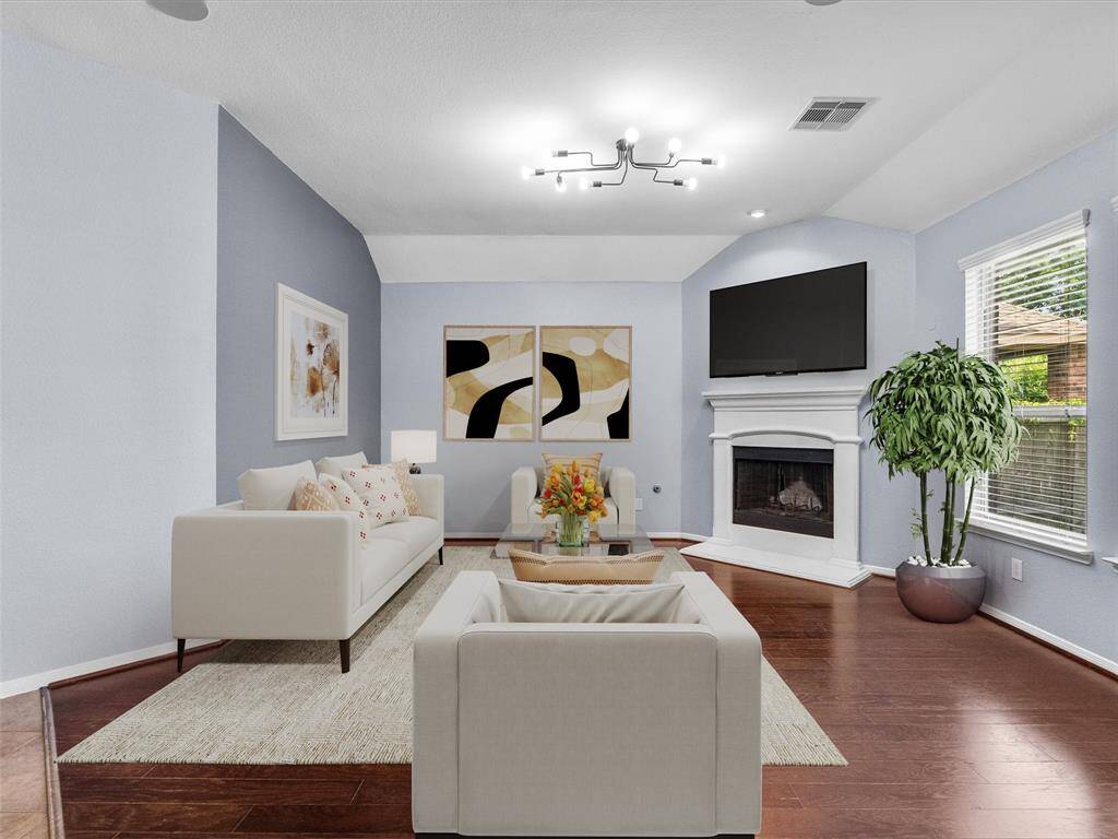 The living room features a cozy fireplace