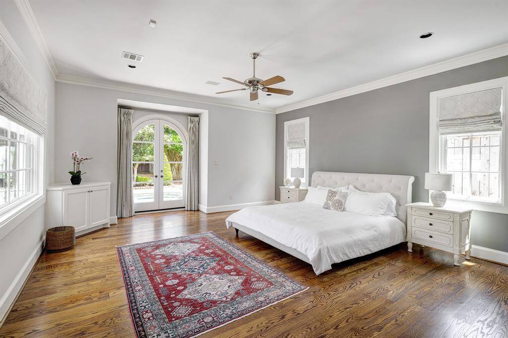 This primary bedroom is a sanctuary from the world's hustle and bustle; wake up and walk right through the arched doorway for a morning swim