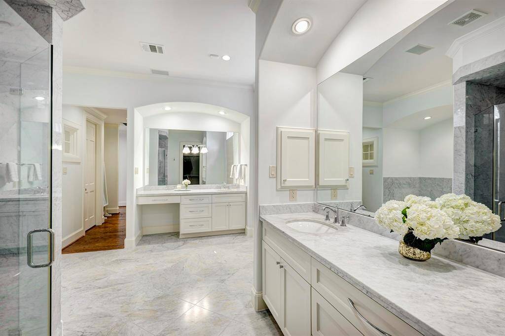 Opulence and serenity in this marble-accented primary bath