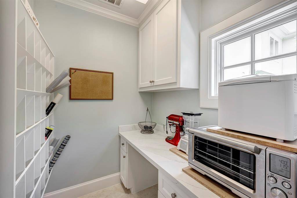 Craft room behind kitchen and next to pantry