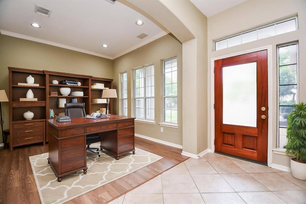 High ceiling, wide arched doorway and soothing walls set the background for a home office . . . or whatever your lifestyle needs!