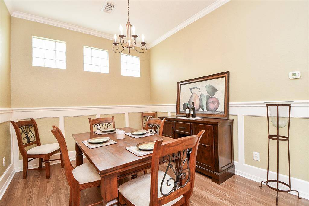It's the little details in a special home like this one, that make it so comfortably unique, like the sweet trio of windows in this spacious formal dining area.