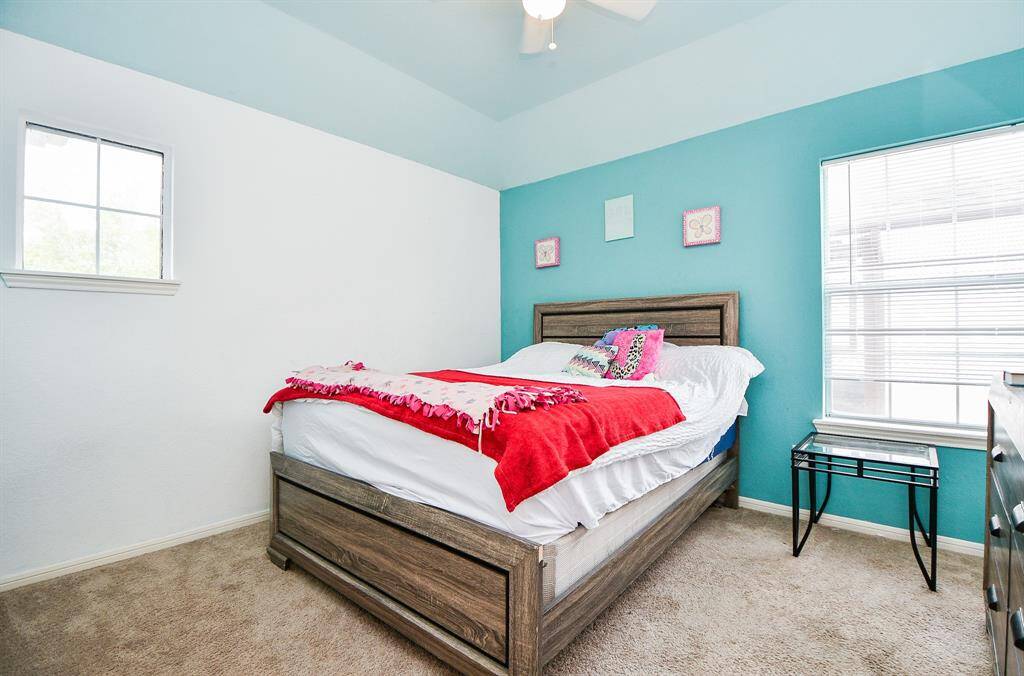 Sizeable pieces are at home in a carpeted secondary bedroom.