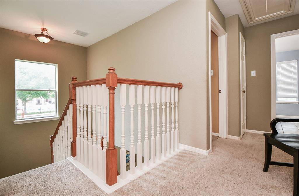 Here we are on the comfortable 2nd floor landing, with earth toned walls and carpeting, everywhere.