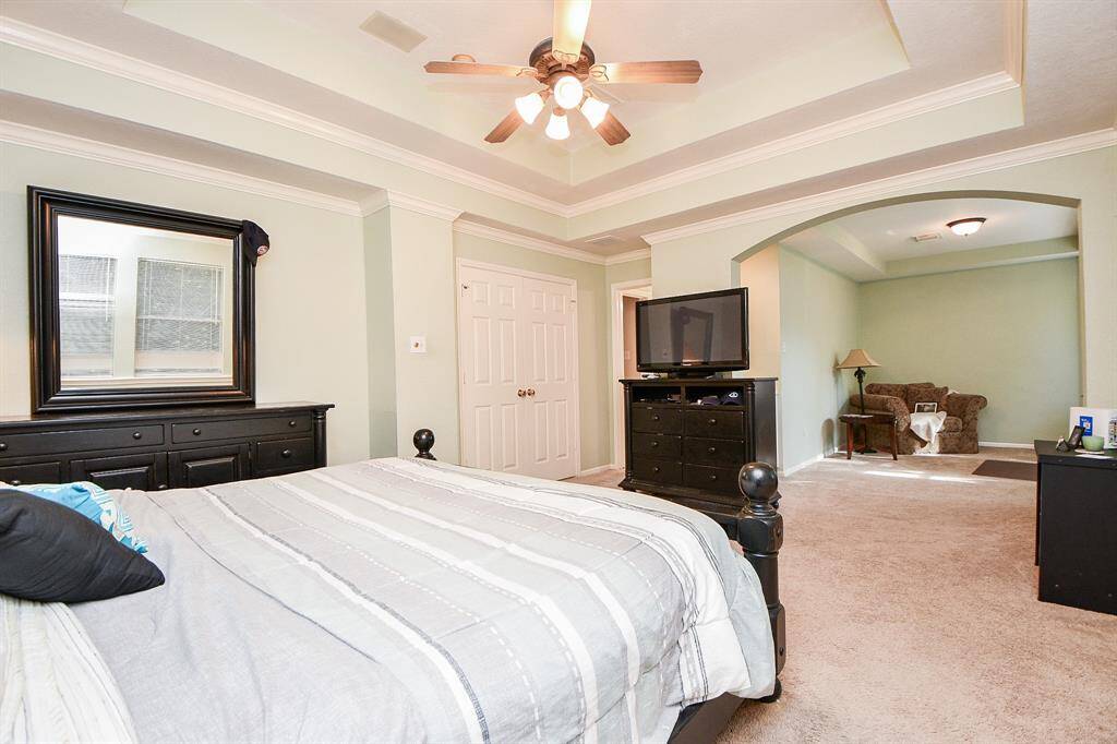 'Not quite ready to turn in? Take full advantage of the tranquil sitting room in your primary suite, beyond the wide arched doorway. Also, note the addition of a tray ceiling, which adds instant warmth and intimacy to any space.