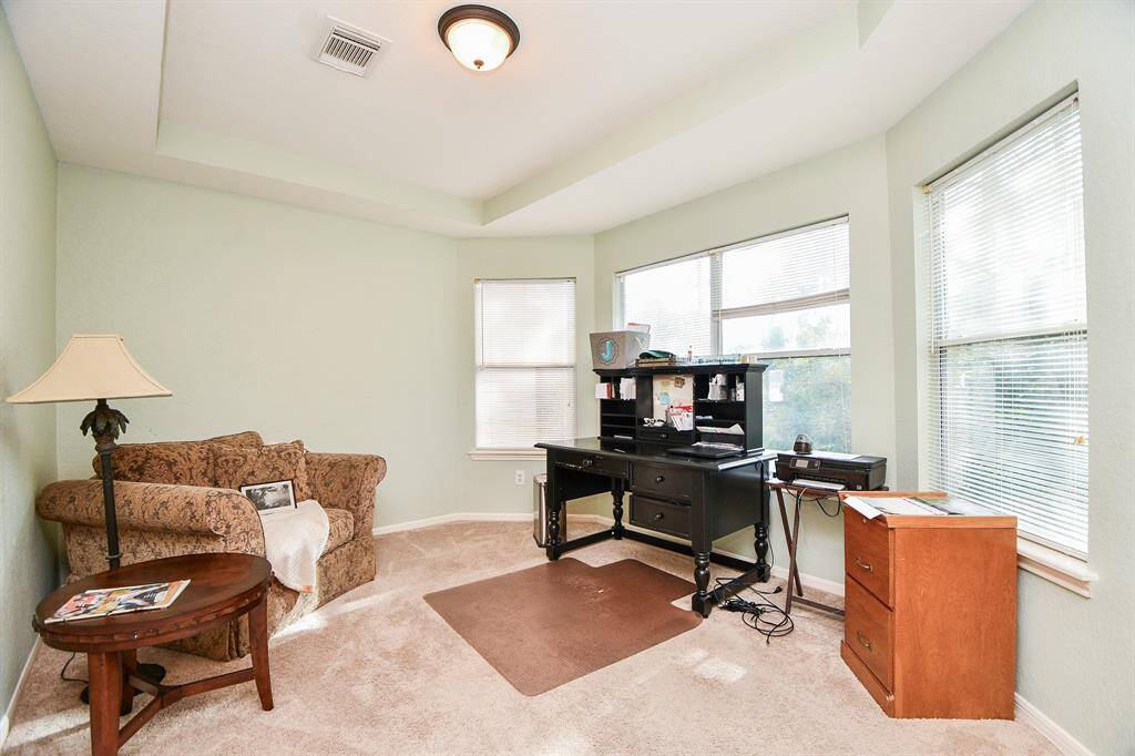 Here's a great extra space in the primary bedroom, currently used as an office.