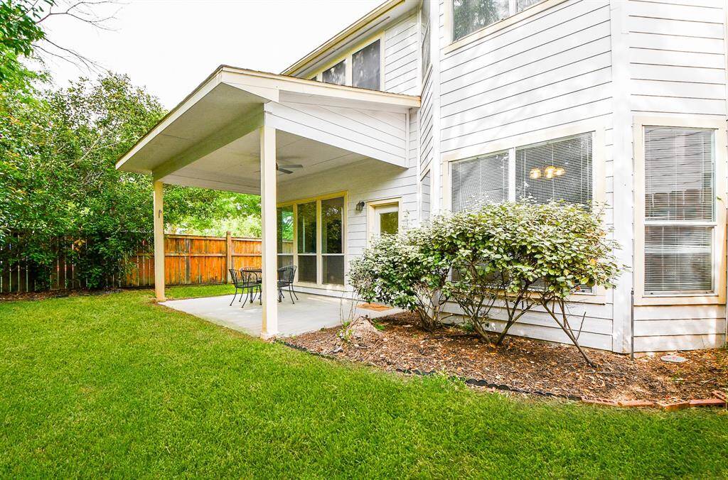 Aren't these windows lovely to look at? Imagine them from the inside, too! This spacious covered patio will be the place for summer fun and entertaining!