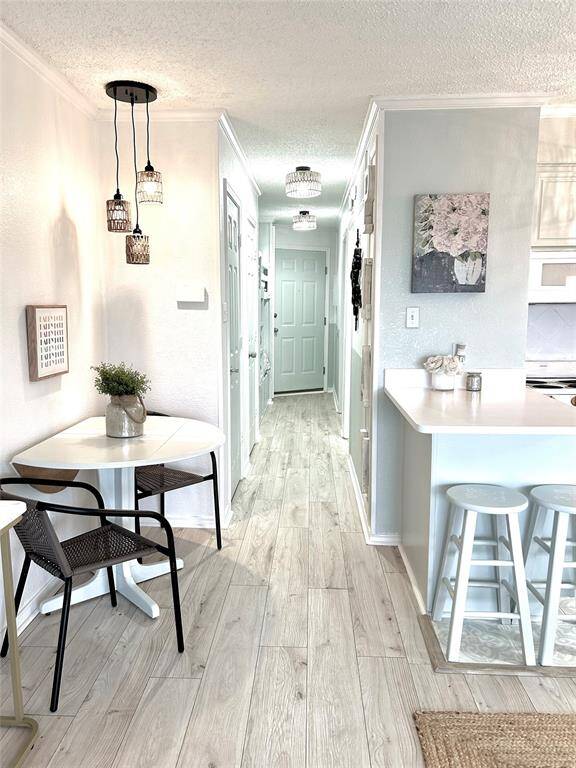 The beautiful flooring and view to the front of the condo