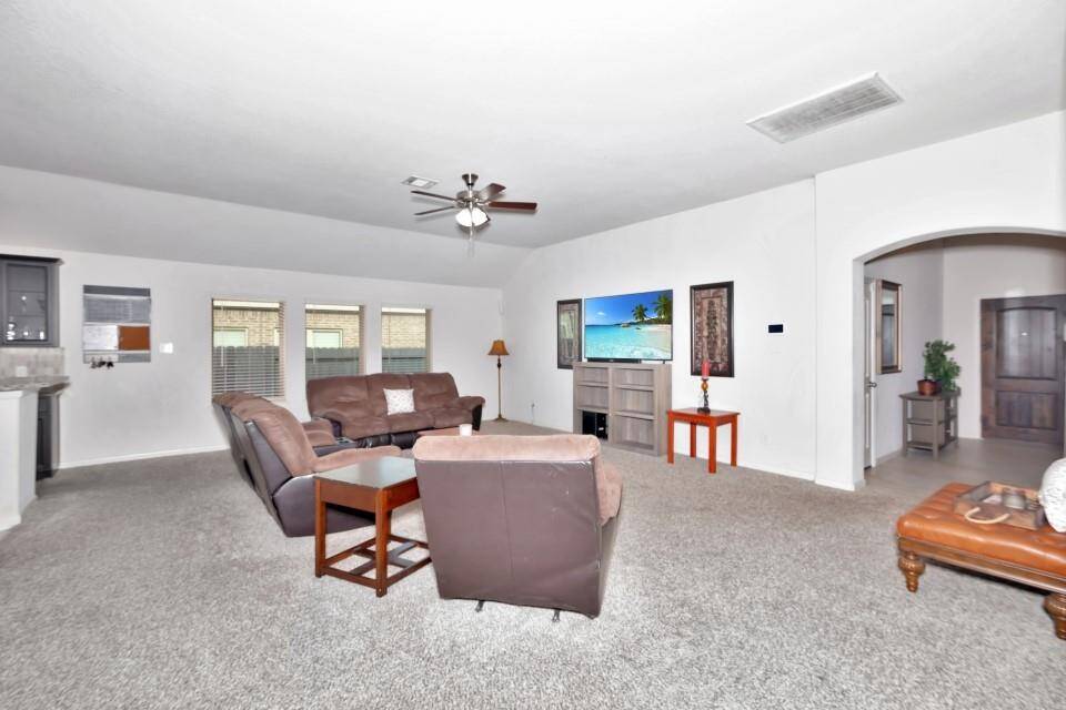 Enjoy this spacious living room that is open to the formal dining and kitchen. The living room has plenty of space for over sized furniture.