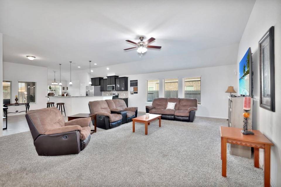 View from living room towards the open kitchen and breakfast area.