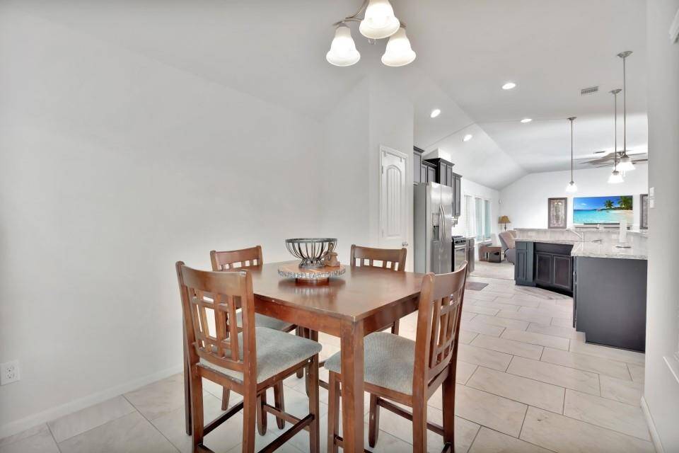 View of breakfast area looking towards the kitchen and living area.